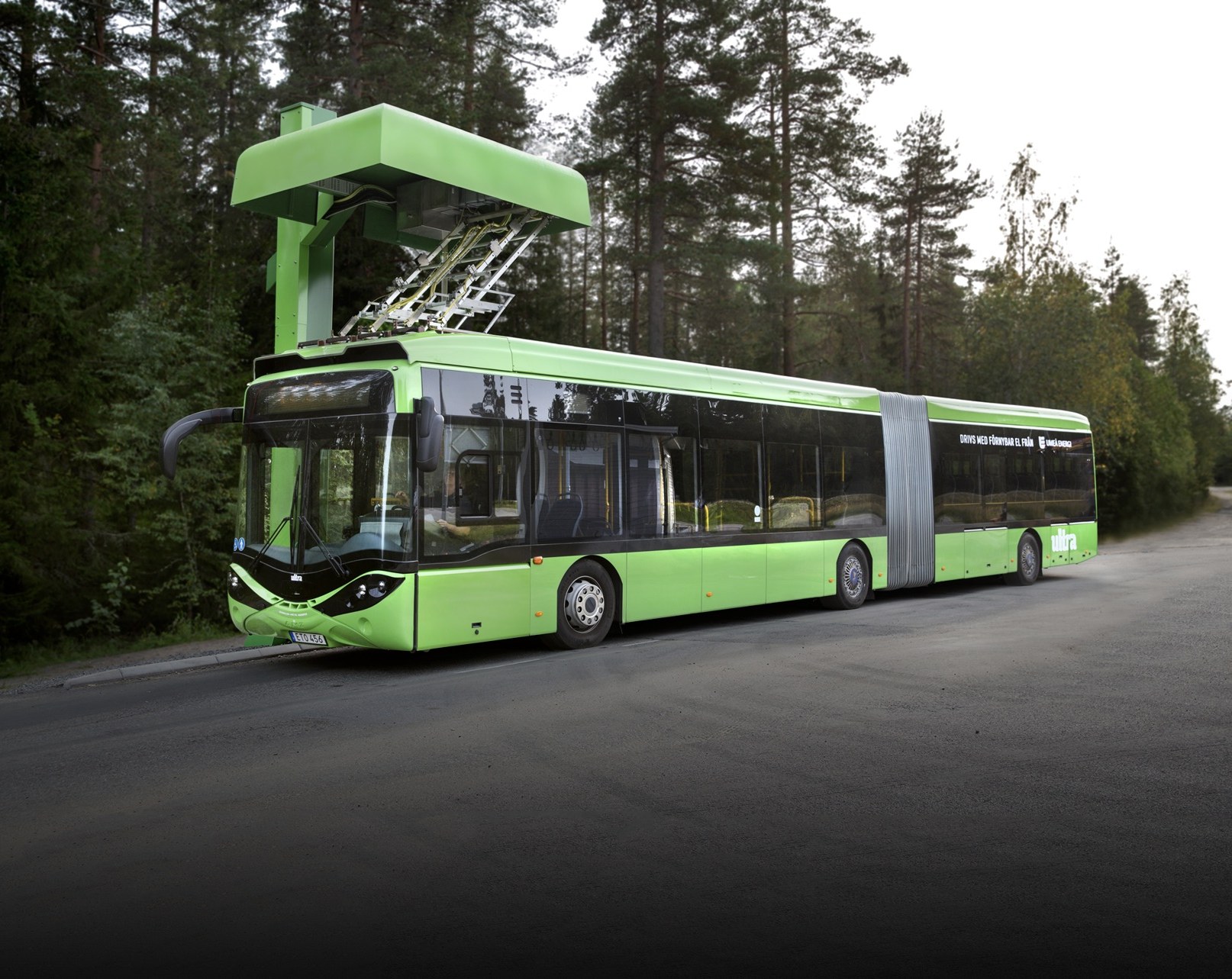 Articulated electric city bus charging under a pantograph opportunity charger
